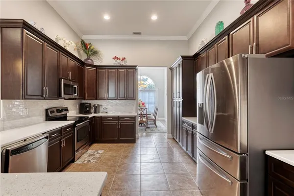 a bathroom with a granite countertop sink a toilet and a mirror
