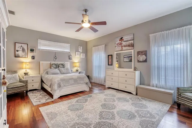 a living room with furniture a rug and a chandelier
