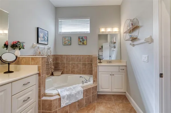 a en suite bathroom with a sink shower and a mirror