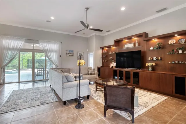 a living room with furniture and large windows