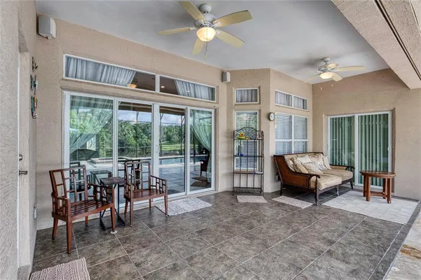 an aerial view of a house with a garden and lake view