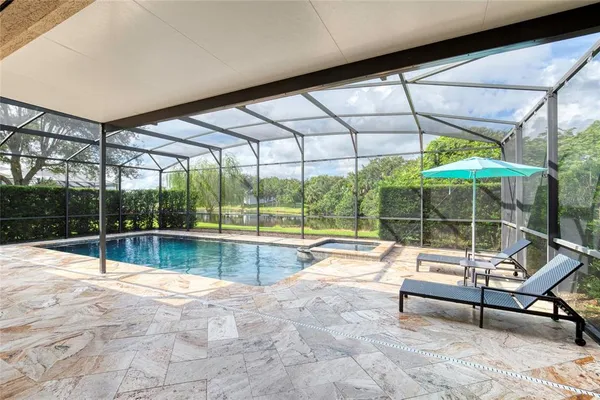 a view of a house with a yard and sitting area
