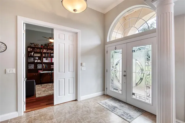 a kitchen with stainless steel appliances granite countertop a refrigerator a sink dishwasher a stove and a refrigerator with wooden floor