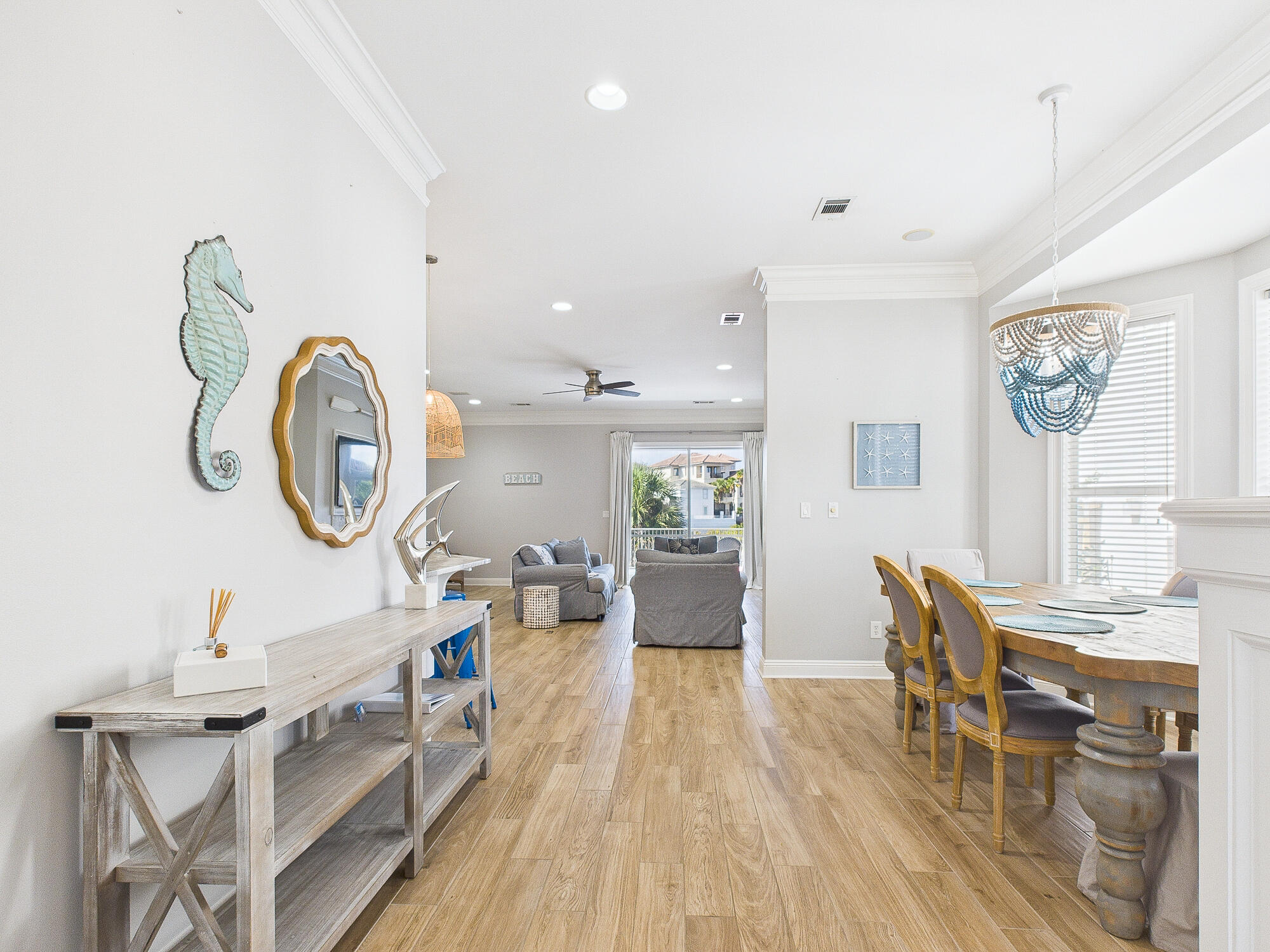 4634 Sunset Pointe Destin, FL 32541 - Photo 11 of 68 a living room with furniture and a clock