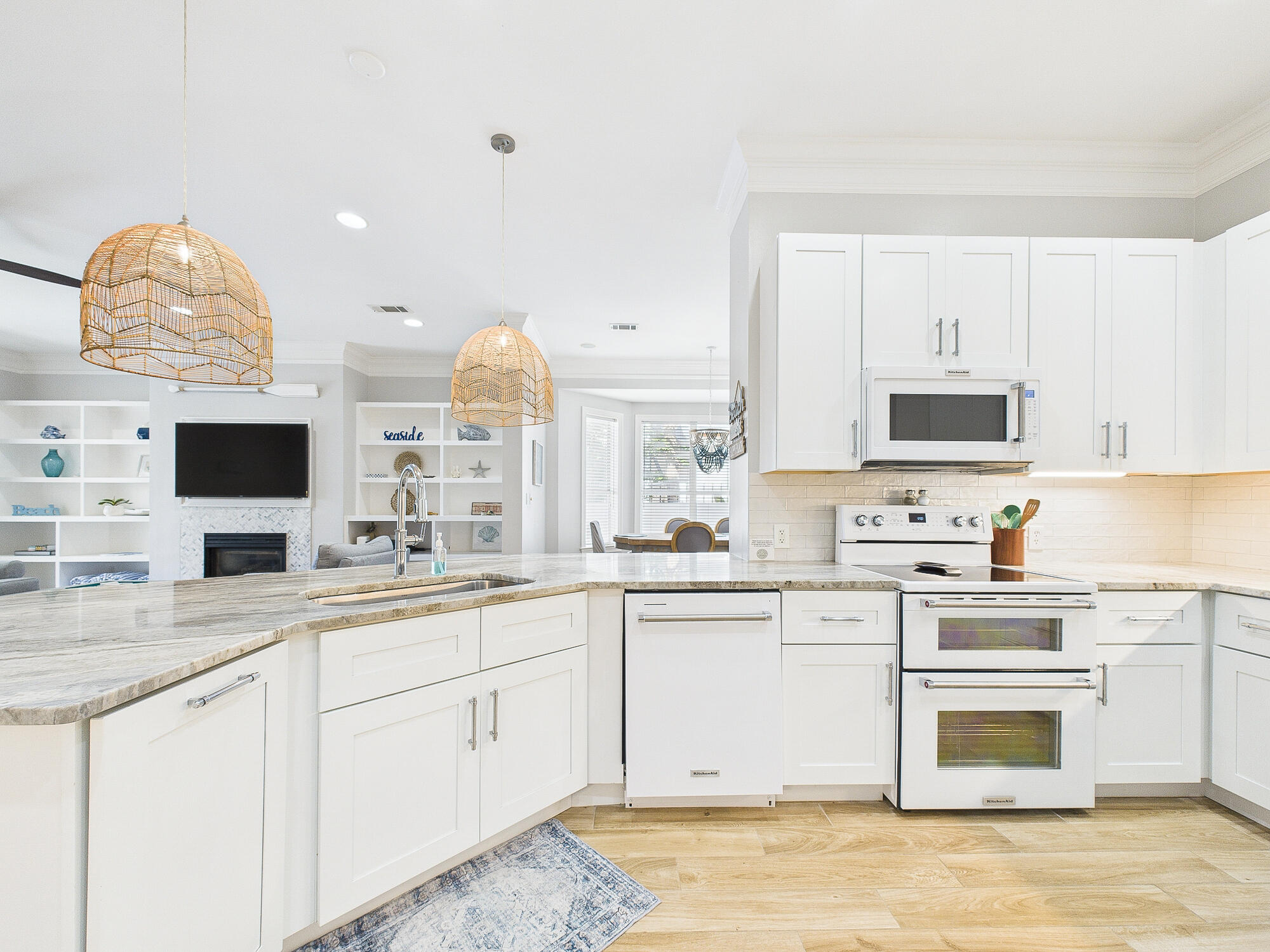 4634 Sunset Pointe Destin, FL 32541 - Photo 16 of 68 a kitchen with a sink stove and microwave