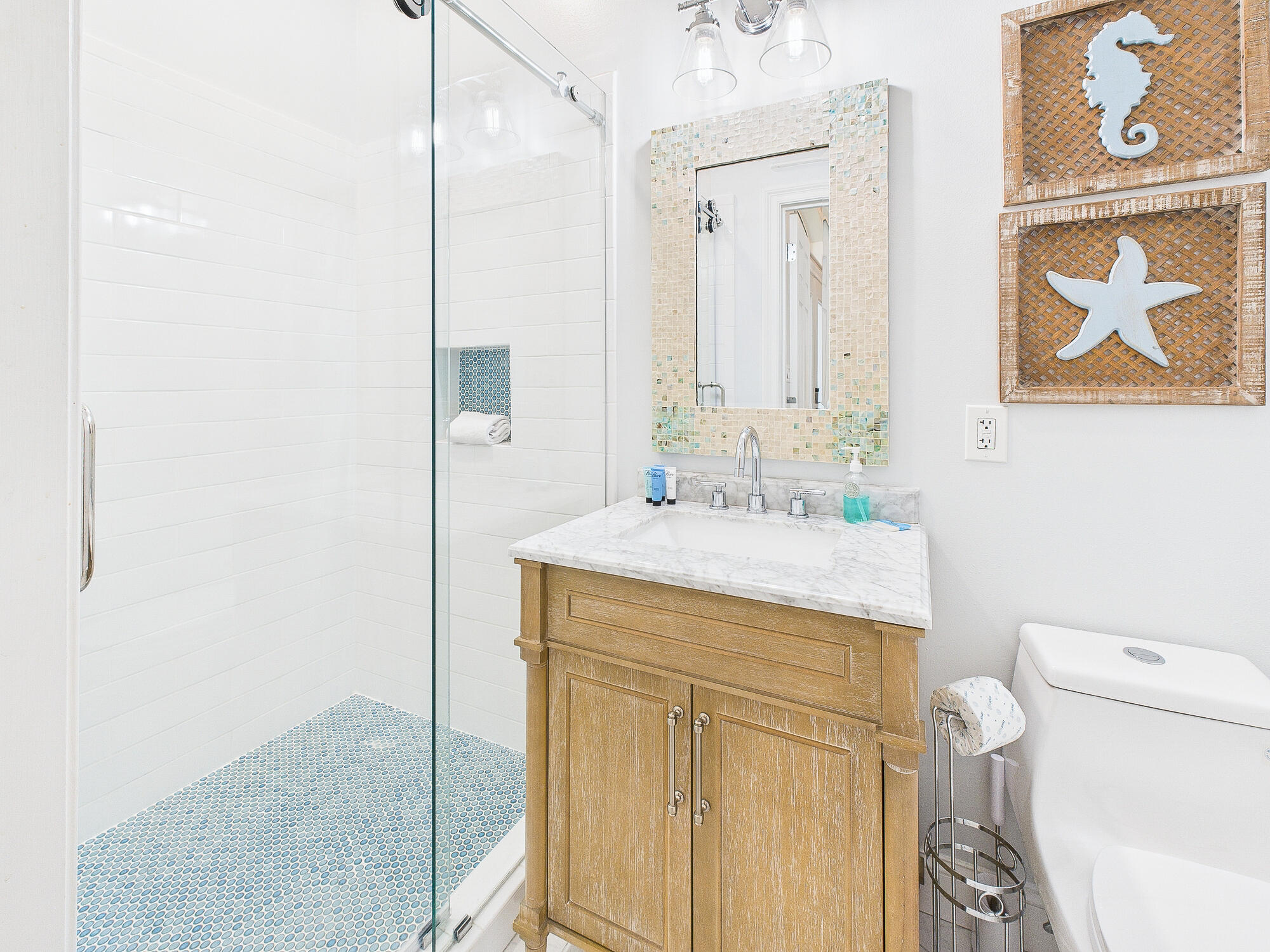4634 Sunset Pointe Destin, FL 32541 - Photo 20 of 68 a bathroom with a granite countertop sink a toilet and a mirror