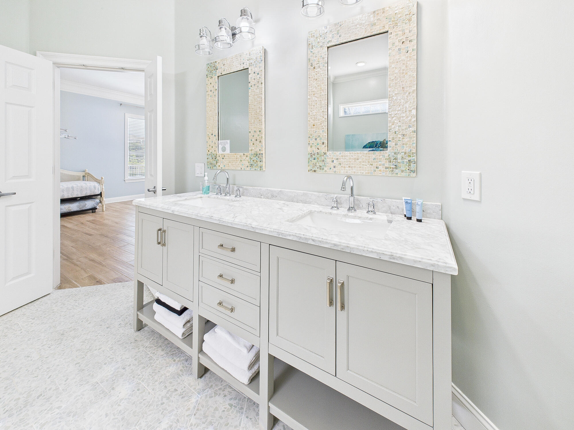 4634 Sunset Pointe Destin, FL 32541 - Photo 30 of 68 a spacious bathroom with a granite countertop sink and a mirror