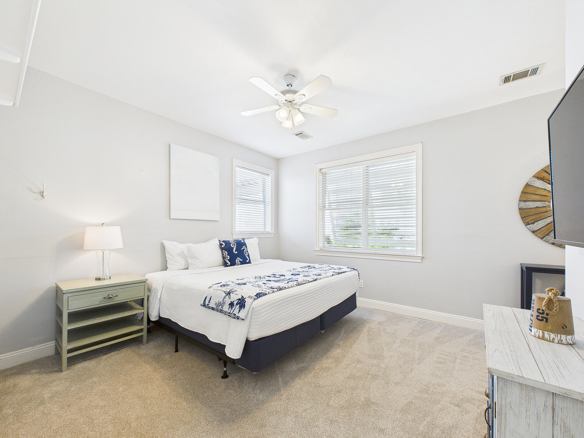 4634 Sunset Pointe Destin, FL 32541 - Photo 33 of 68 a bedroom with a bed a chandelier and a window