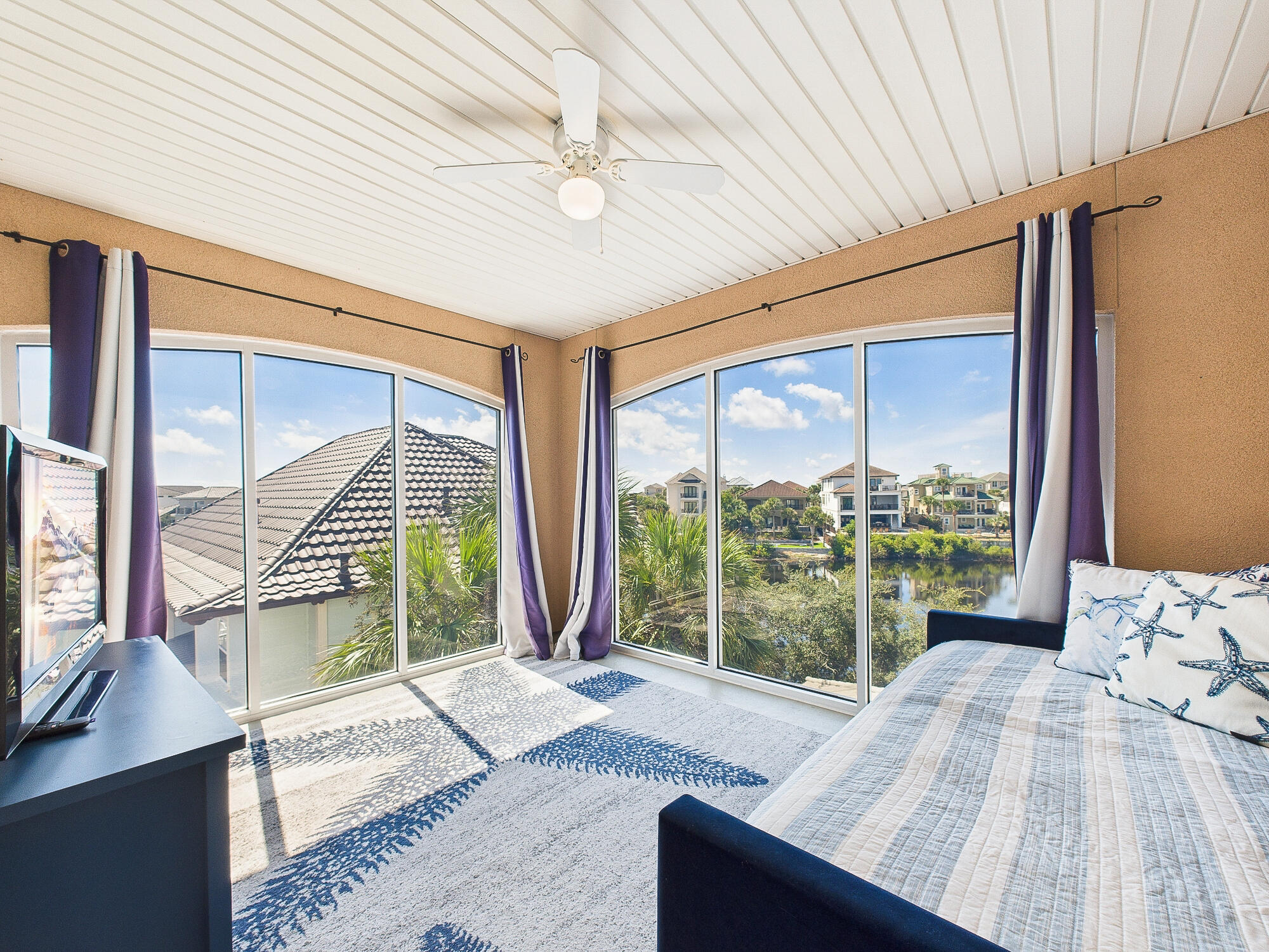 4634 Sunset Pointe Destin, FL 32541 - Photo 43 of 68 a bedroom with a bed and large window with outer view