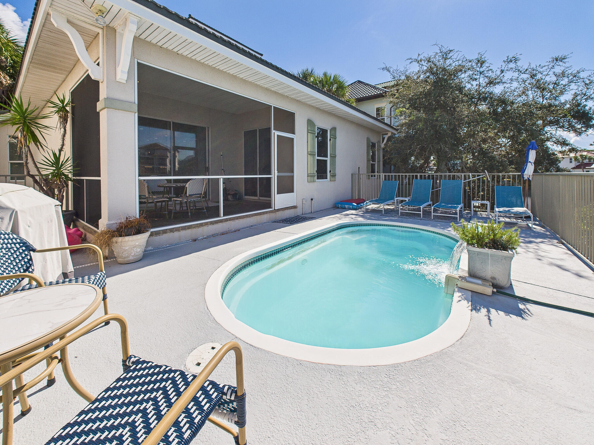 4634 Sunset Pointe Destin, FL 32541 - Photo 51 of 68 a view of a swimming pool with chairs