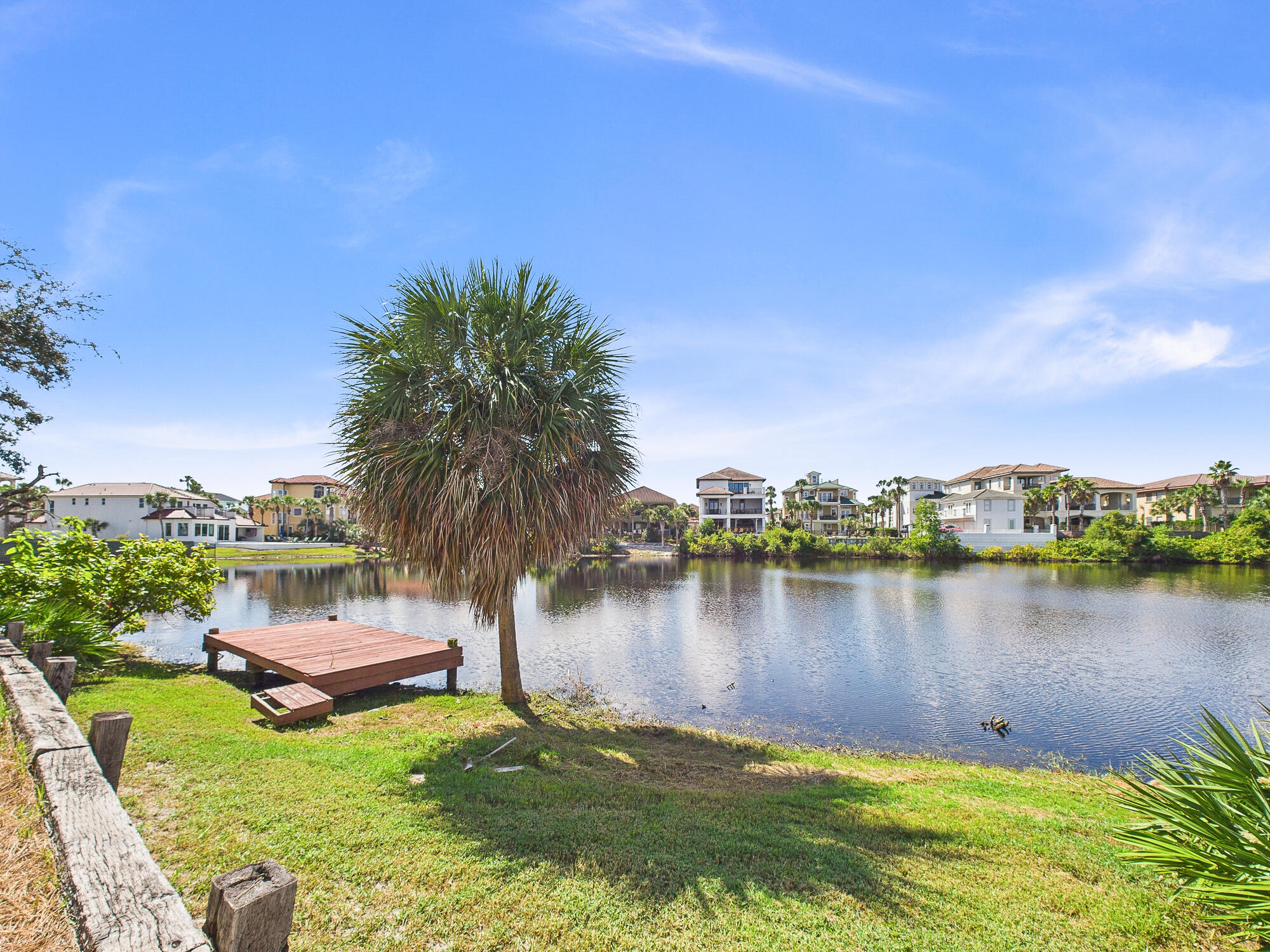 4634 Sunset Pointe Destin, FL 32541 - Photo 52 of 68 a view of a lake with houses in the back