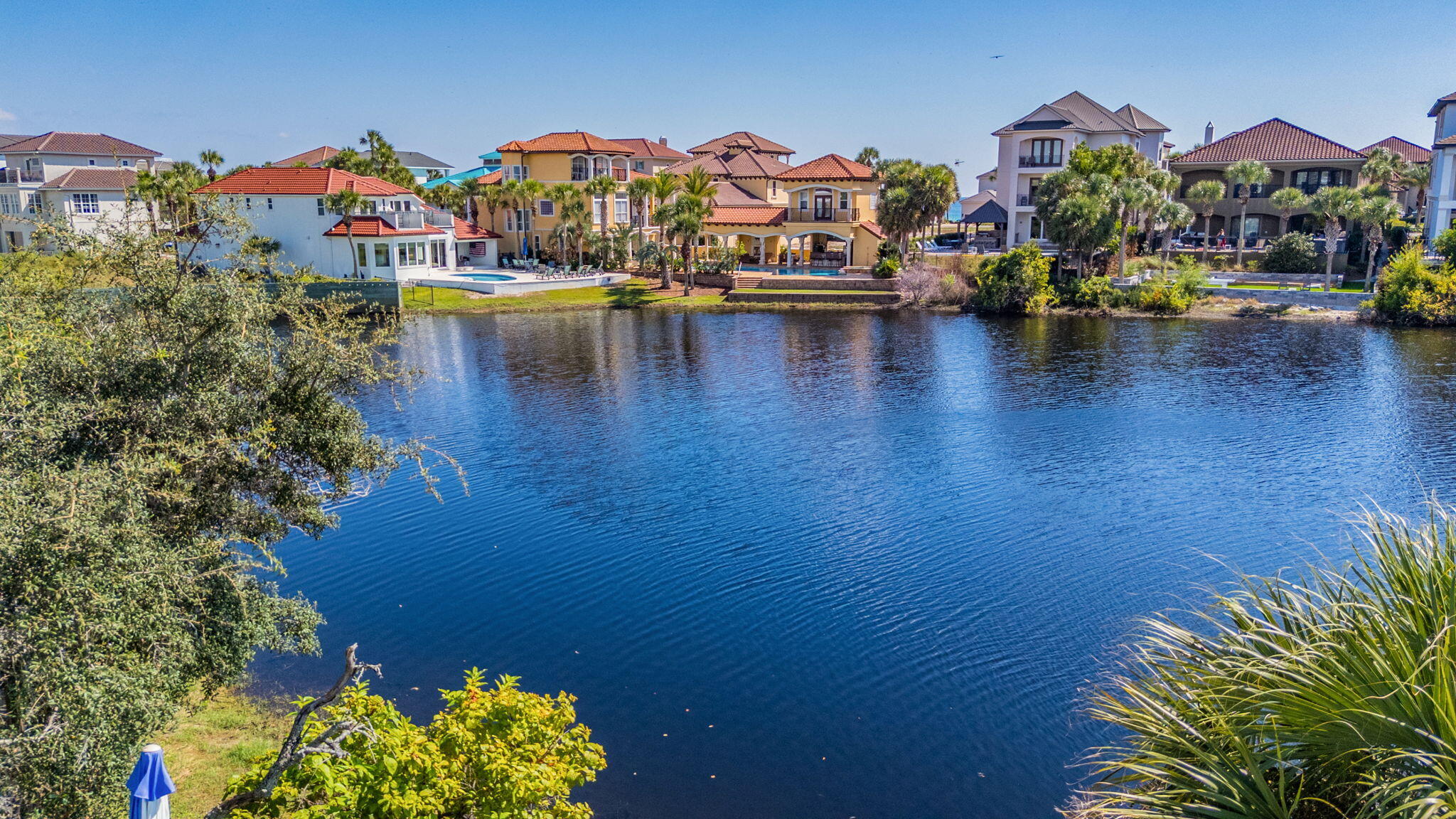 4634 Sunset Pointe Destin, FL 32541 - Photo 62 of 68 a view of a swimming pool with a terrace