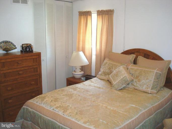 4734 Byron Road Windsor Mill, MD 21244 - Photo 4 of 10 a bedroom with a bed and window