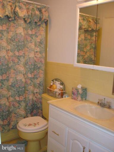 4734 Byron Road Windsor Mill, MD 21244 - Photo 7 of 10 a bathroom with a sink and a toilet