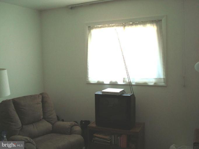4734 Byron Road Windsor Mill, MD 21244 - Photo 8 of 10 a living room with furniture and a window
