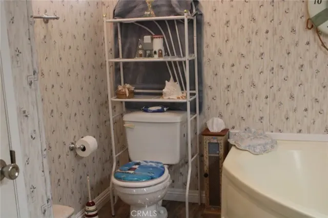 a bathroom with double vanity sinks and a mirror