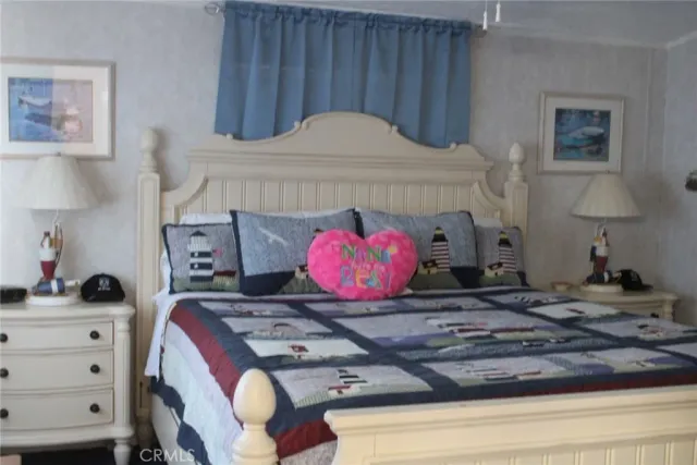 a view of a balcony with chairs and wooden floor