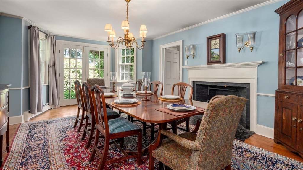 49 Salem Street Andover, MA 01810 - Photo 4 of 39 a dining room with furniture a chandelier and wooden floor