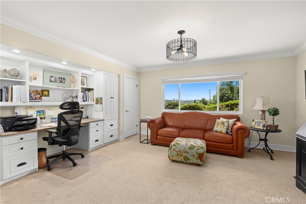 3237 Canonita Drive Fallbrook, CA 92028 - Photo 15 of 55 a livingroom with workspace a couch and a window