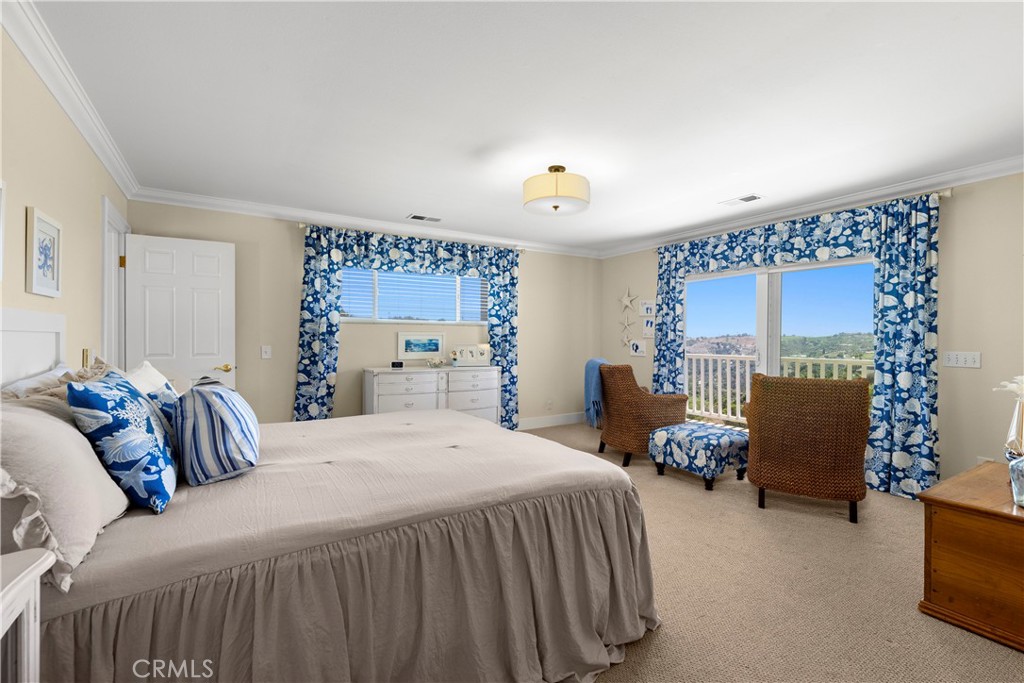 3237 Canonita Drive Fallbrook, CA 92028 - Photo 18 of 55 a bedroom with a bed couch and a window