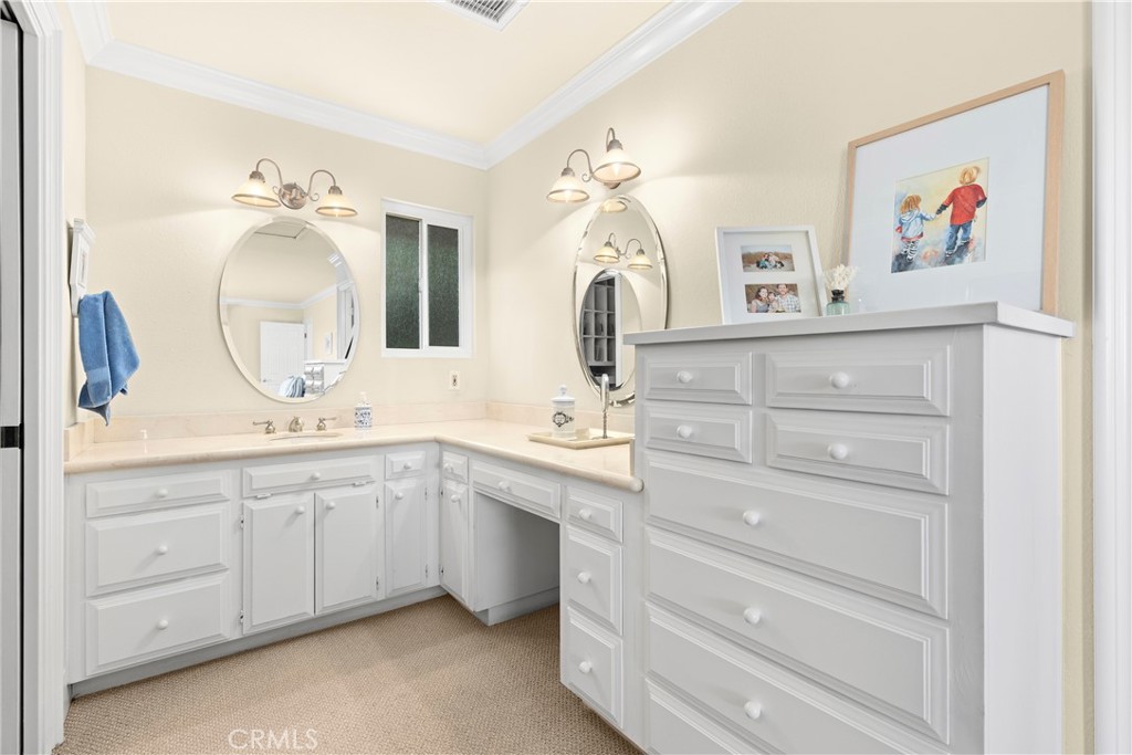 3237 Canonita Drive Fallbrook, CA 92028 - Photo 23 of 55 a bathroom with a double vanity sink and a mirror