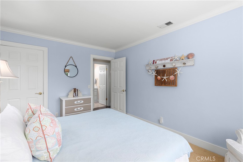 3237 Canonita Drive Fallbrook, CA 92028 - Photo 27 of 55 a bedroom with a bed and cabinets