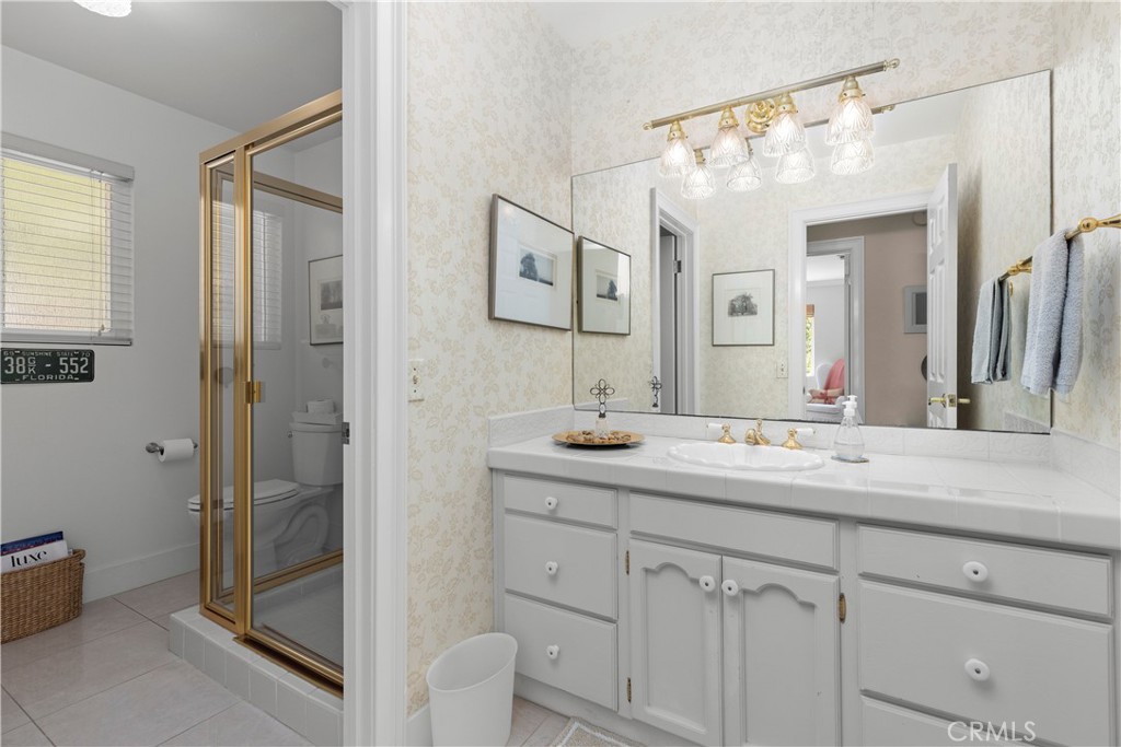 3237 Canonita Drive Fallbrook, CA 92028 - Photo 29 of 55 a bathroom with a granite countertop sink mirror and double