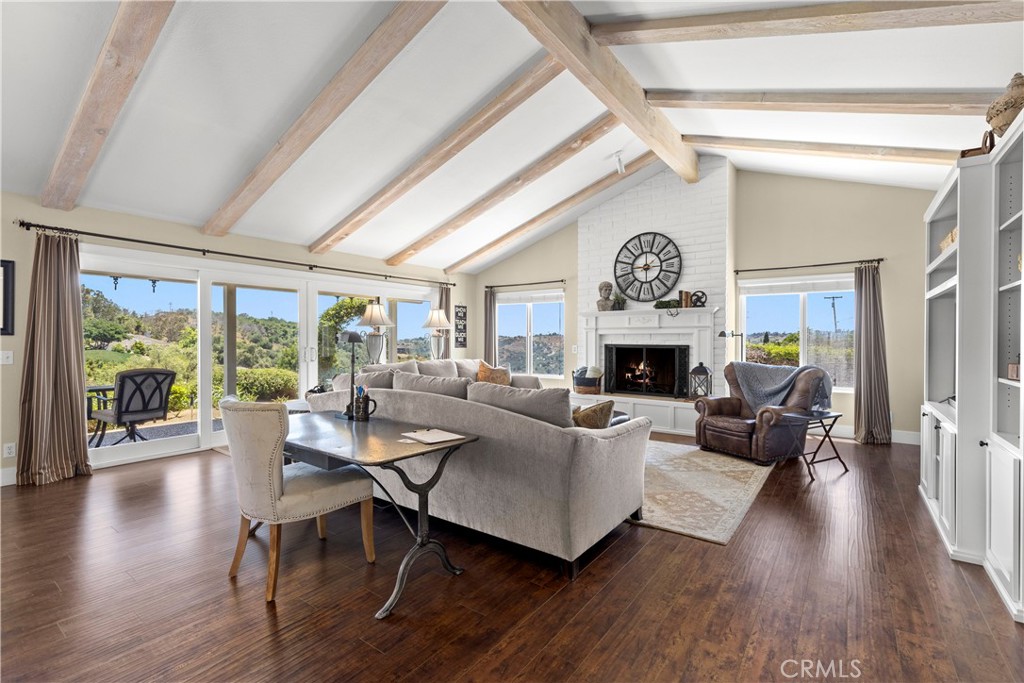 3237 Canonita Drive Fallbrook, CA 92028 - Photo 3 of 55 a living room with fireplace furniture and a large window