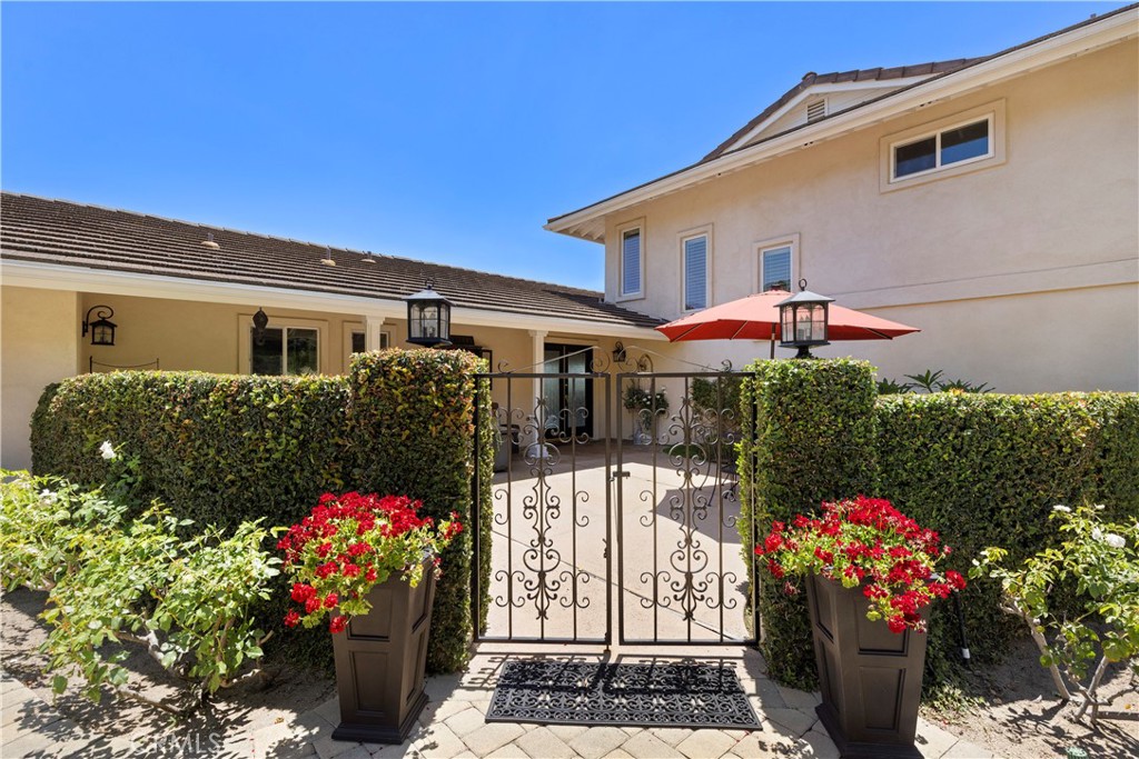 3237 Canonita Drive Fallbrook, CA 92028 - Photo 36 of 55 a front view of a house with a yard and fountain