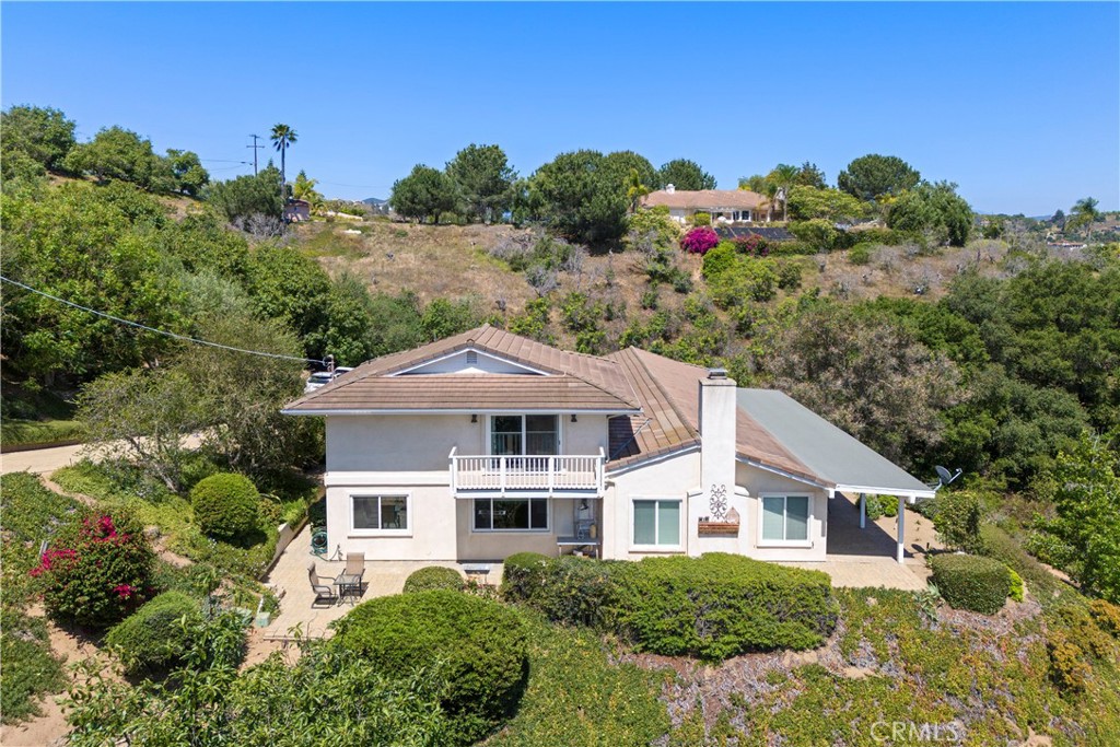 3237 Canonita Drive Fallbrook, CA 92028 - Photo 43 of 55 a front view of a house with a yard and potted plants