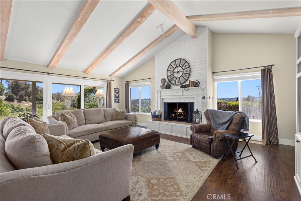 3237 Canonita Drive Fallbrook, CA 92028 - Photo 5 of 55 a living room with furniture large window and a fireplace