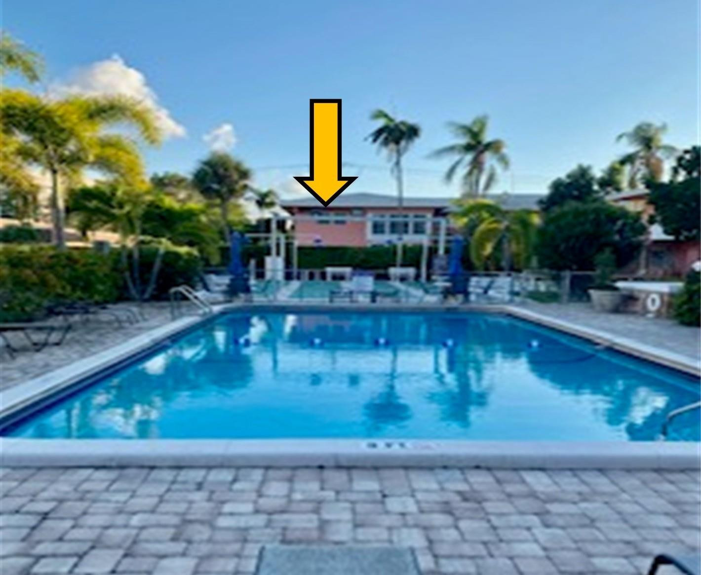 a view of a swimming pool with a patio