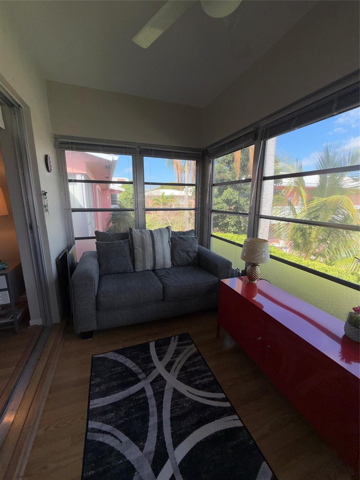 Undisclosed Address Boca Raton, FL 33431 - Photo 13 of 32 a living room with furniture and a floor to ceiling window
