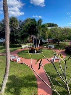 Undisclosed Address Boca Raton, FL 33431 - Photo 18 of 32 a view of a park with swings and slides