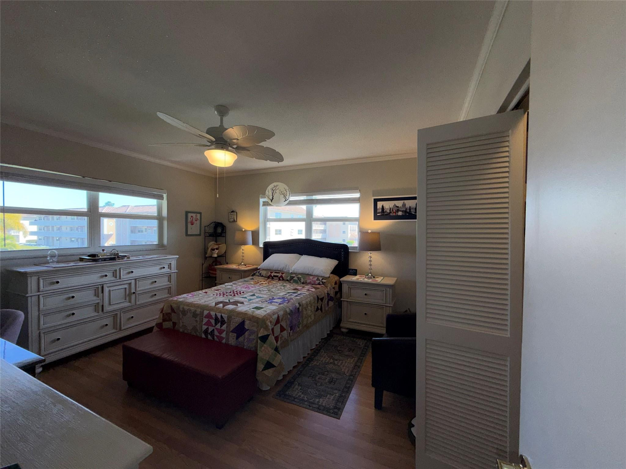 Undisclosed Address Boca Raton, FL 33431 - Photo 22 of 32 a bedroom with a bed and a dresser