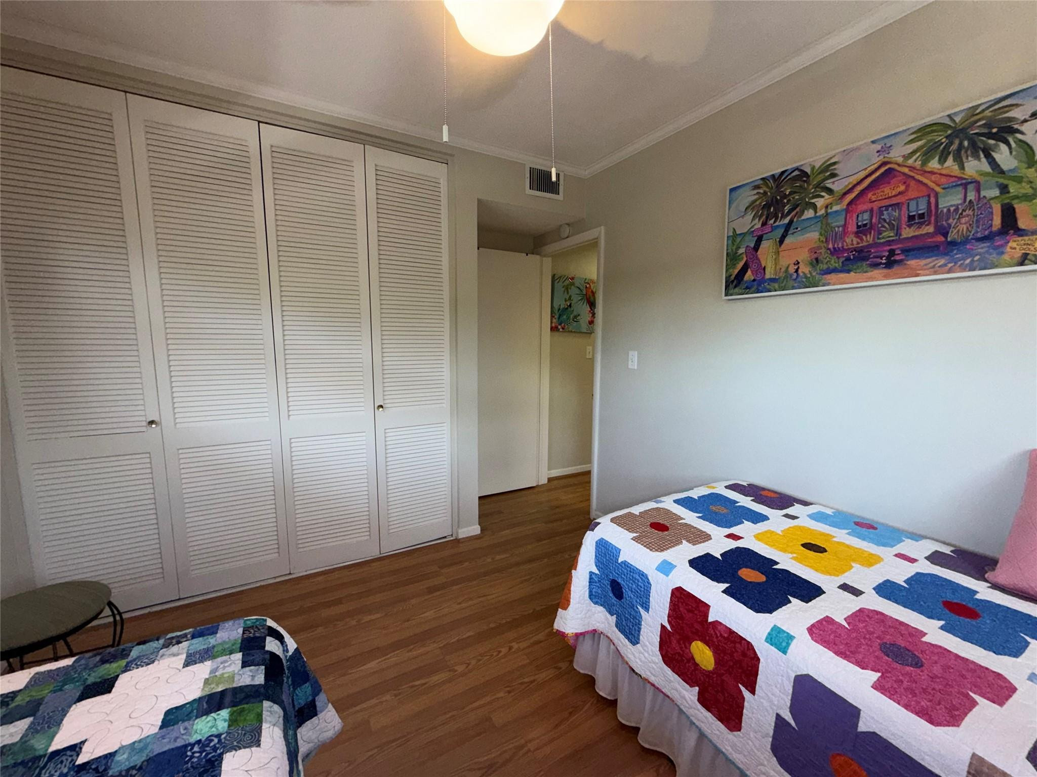Undisclosed Address Boca Raton, FL 33431 - Photo 25 of 32 a bedroom with a bed and wooden floor