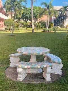 Undisclosed Address Boca Raton, FL 33431 - Photo 31 of 32 a view of a white house with a fountain in a yard