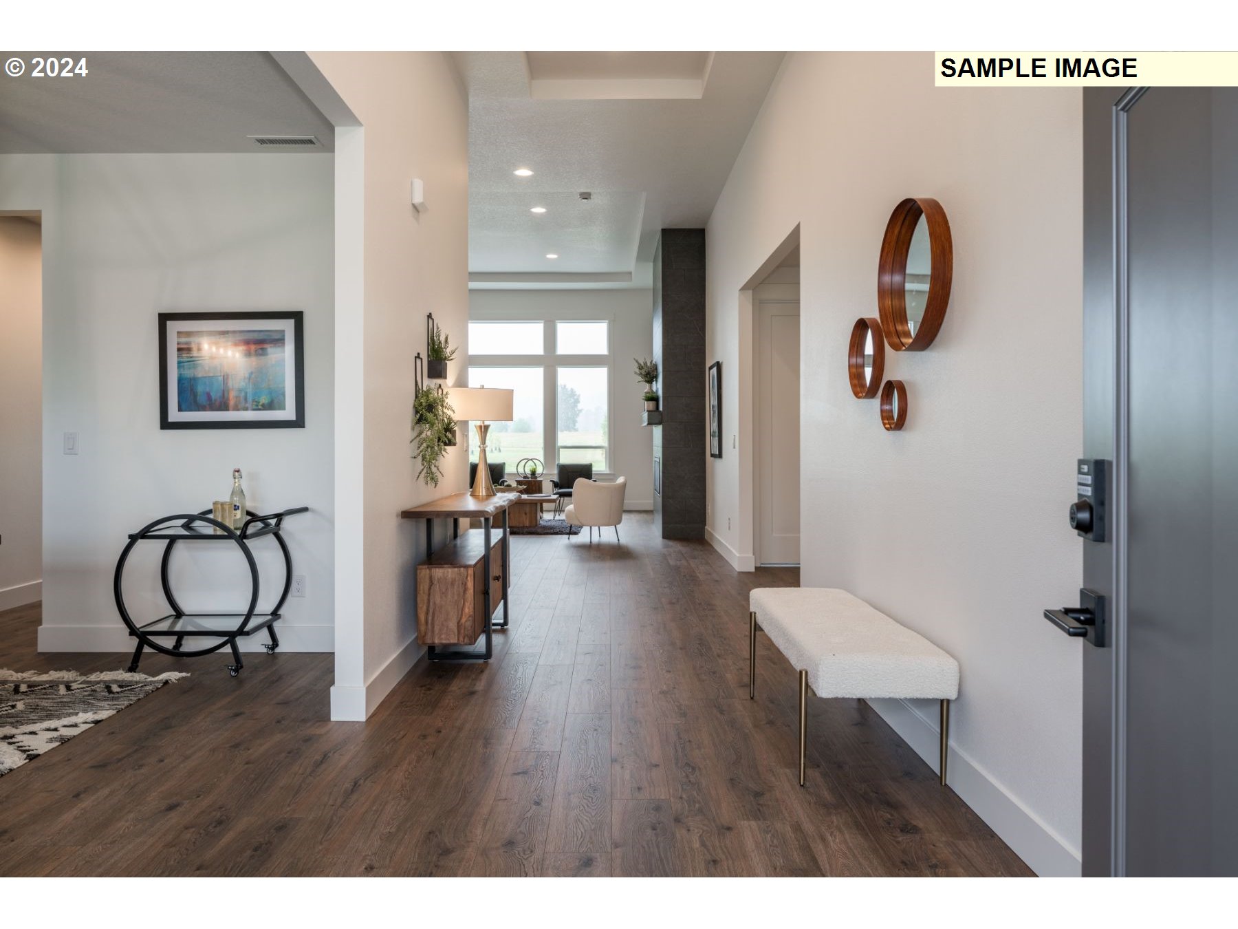 1104 South Mountain Place Ridgefield, WA 98642 - Photo 3 of 8 a view of a hallway with wooden floor and furniture