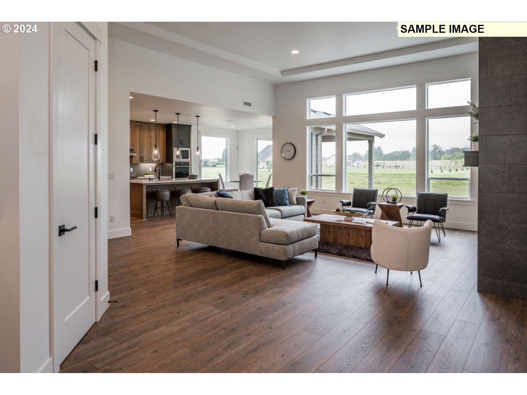 1104 South Mountain Place Ridgefield, WA 98642 - Photo 5 of 8 a living room with furniture and a large window