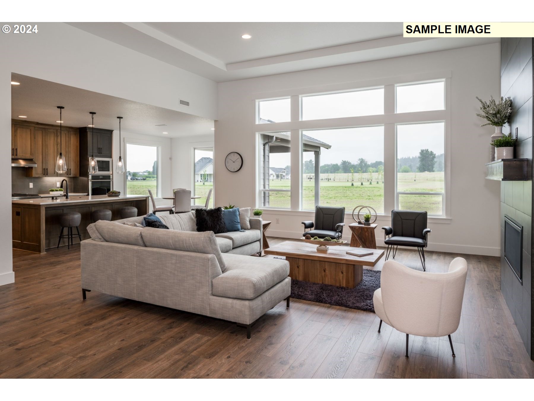 1104 South Mountain Place Ridgefield, WA 98642 - Photo 6 of 8 a living room with furniture and large windows