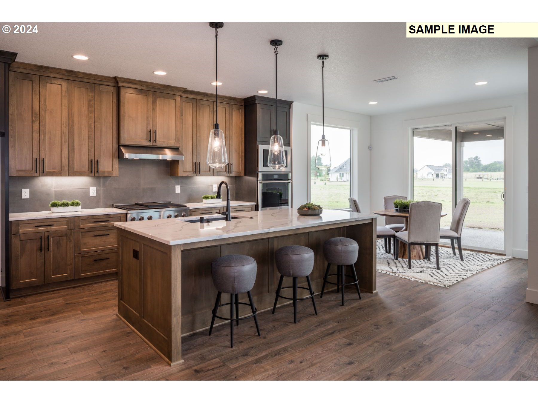 1104 South Mountain Place Ridgefield, WA 98642 - Photo 7 of 8 a open kitchen with granite countertop a sink appliances and cabinets