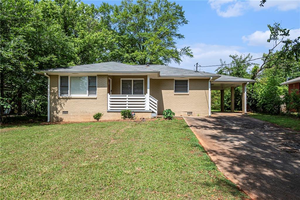 1412 Richard Road Decatur, GA 30032 - Photo 1 of 1 a front view of a house with a yard