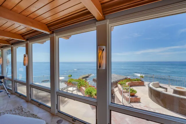 a kitchen with stainless steel appliances kitchen island granite countertop a table and chairs