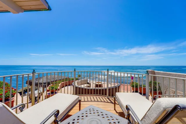 a view of a balcony with furniture