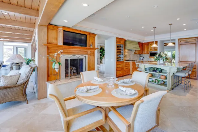 a spacious bedroom with a bed and a flat screen tv