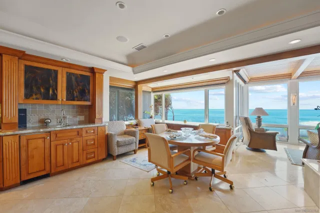 a living room with furniture a window and a chandelier