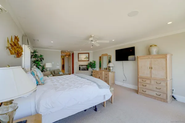 a spacious bedroom with a bed and a walk in closet