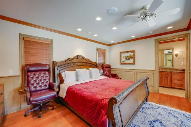a large bedroom with a large bed and furniture