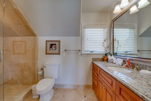 an aerial view of a house with outdoor space