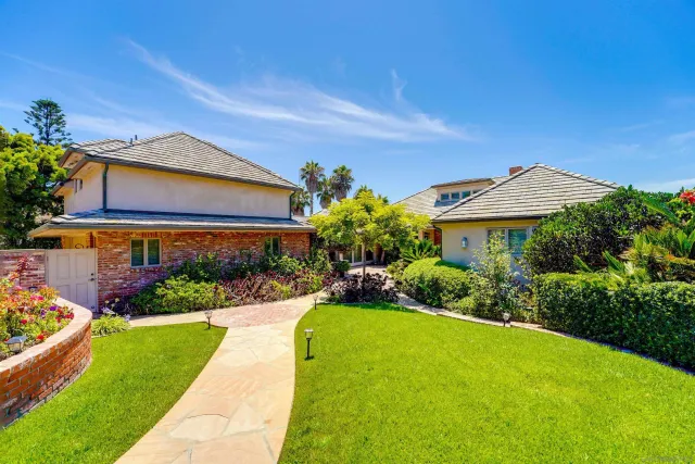 a living room with fireplace furniture and a large window